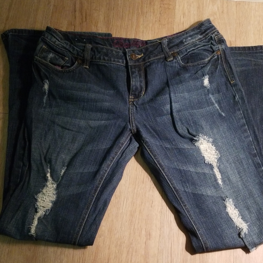 Distressed boot cut stretch jeans